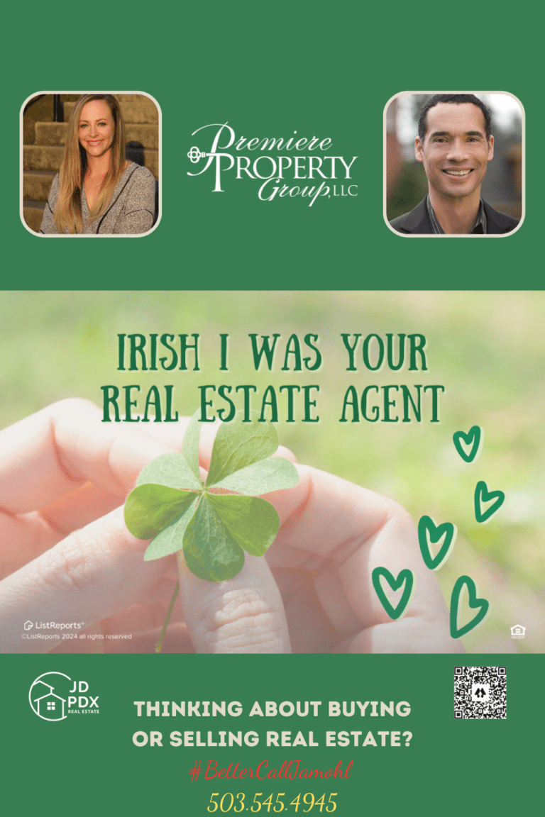 Irish I Was Your Agent. Promotional real estate image with a vibrant green four-leaf clover held in someone's fingers at the top. Text reads 'IRISH I WAS YOUR REAL ESTATE AGENT' with the caption 'THINKING ABOUT BUYING OR SELLING REAL ESTATE?' followed by the hashtag '#BetterCall[Name]' and a phone number. Two headshots of smiling real estate agents and logos for JD PDX Real Estate and Premiere Property Group LLC, along with a QR code, are at the bottom.